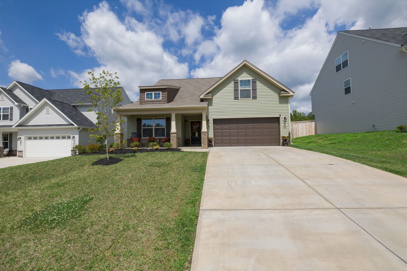 Suburban Edmonton-area home with a driveway ready for a bin